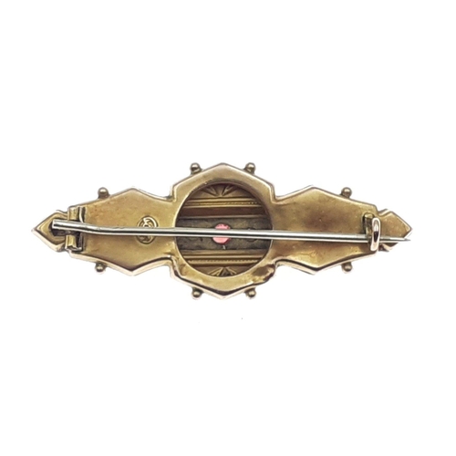 5 - A boxed 9c stamped turn of the 20th century brooch with garnet stone centred with seed pearls - gros... 