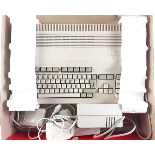 A boxed COMMODORE AMIGA A-500+ in its original box with power leads ...