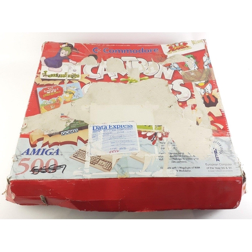 A boxed COMMODORE AMIGA A-500+ in its original box with power leads ...