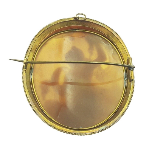 43 - A large gilt CAMEO brooch 7cm approx and in good condition. A nicely sculpted piece#48