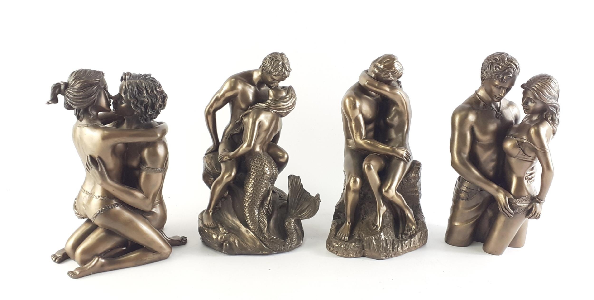 Four bronze effect modern reproduction statues of amorous couples. Each ...