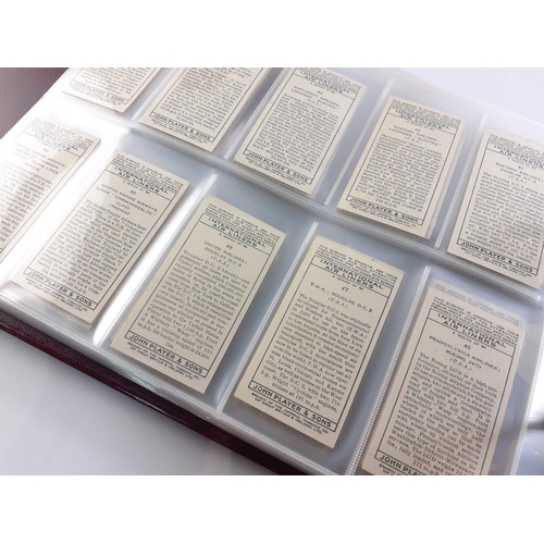 93 - An album in slipcase of tobacco cards containing complete set of WILLS railway engines from 1924, co... 