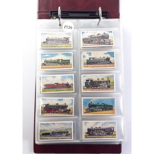 93 - An album in slipcase of tobacco cards containing complete set of WILLS railway engines from 1924, co... 