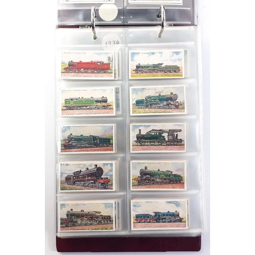 93 - An album in slipcase of tobacco cards containing complete set of WILLS railway engines from 1924, co... 