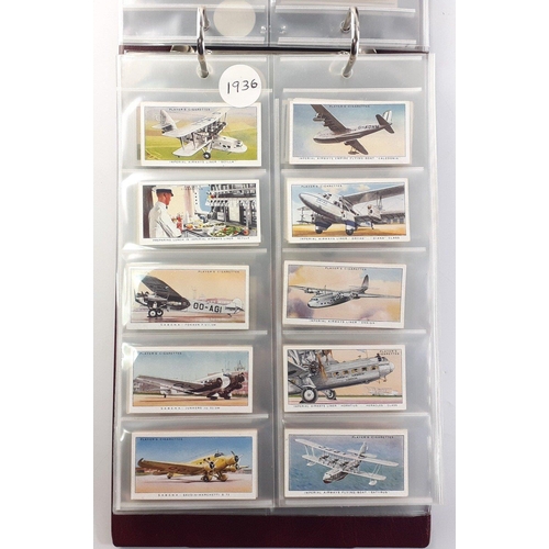 93 - An album in slipcase of tobacco cards containing complete set of WILLS railway engines from 1924, co... 