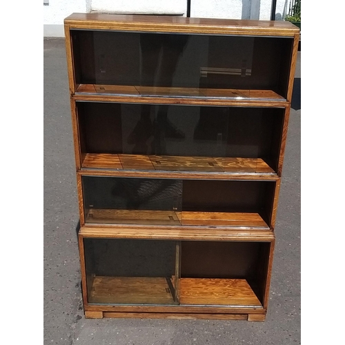 127 - Legal style cabinet with sliding doors. Consists of a base section and 3 joined sections.#134