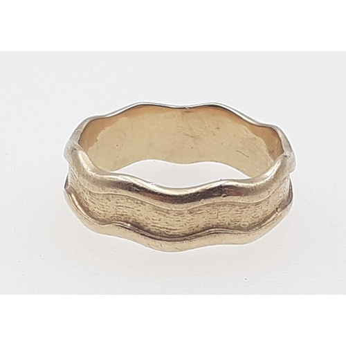 33 - 'I DO'
A superb 375 stamped gents wedding band with wave effect edges.  Bought c. 2003 from the work... 
