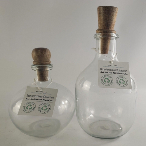 208 - XMAS GIFTING IDEAS! Two recycled glass bottles, larger 25cm tall. Ideal for bath salts.
All brand ne... 