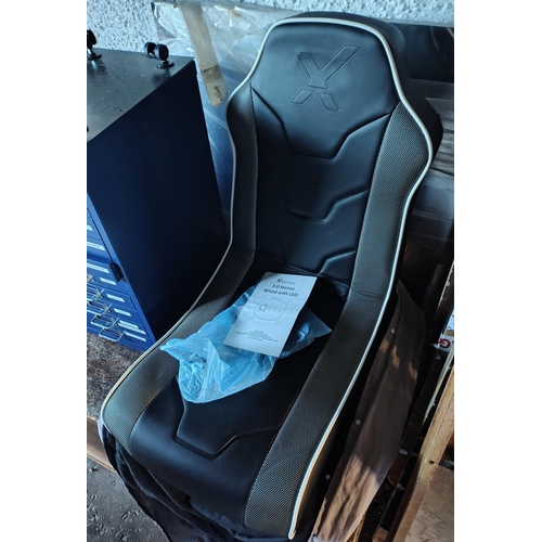 262 - A black coloured X rocker 2.0 stereo gamer chair with LED lights, stereo speakers, all cables and or... 