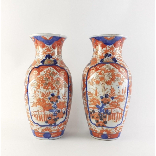 309 - ANTIQUE JAPANESE - An attractive pair of Japanese Imari vases each 31cm high.  Both have historic re... 