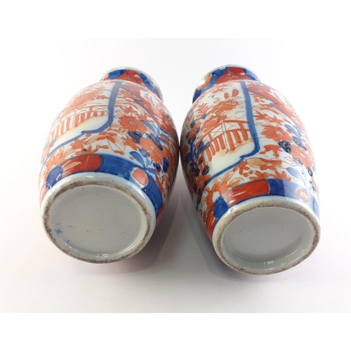 309 - ANTIQUE JAPANESE - An attractive pair of Japanese Imari vases each 31cm high.  Both have historic re... 