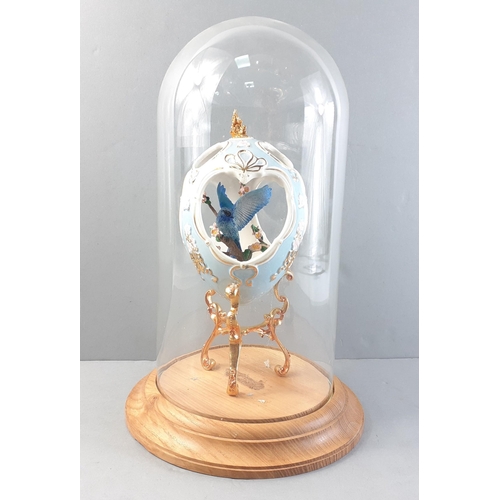 315 - A very pretty ornamental cut out ceramic egg from FRANKLIN MINT with blue bird inside presented in a... 