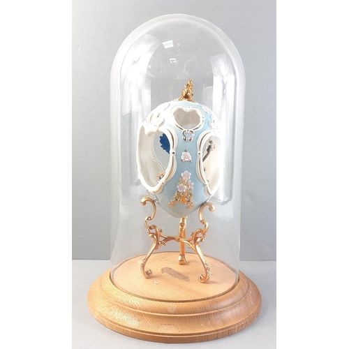 315 - A very pretty ornamental cut out ceramic egg from FRANKLIN MINT with blue bird inside presented in a... 