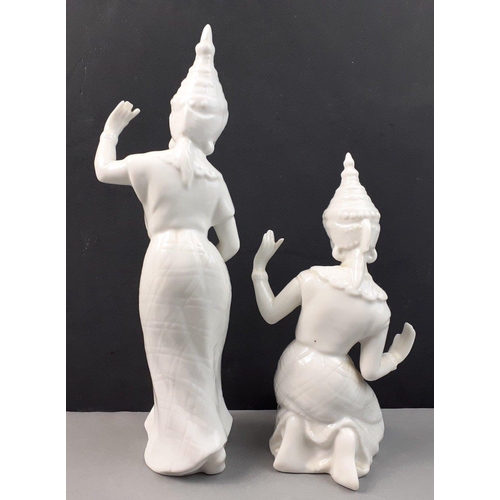 357 - Two white ceramic unbranded Balinese dancers taller 23cm approx, slight damage to the finger tips un... 