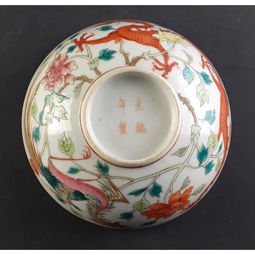 A hand painted Chinese rice bowl in Red Dragon and Phoenix Famille Rose ...