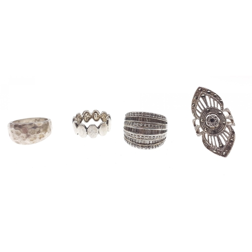 102 - Four nice quality interesting silver rings. Gross weight 30g approx.#124