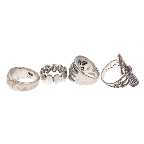 102 - Four nice quality interesting silver rings. Gross weight 30g approx.#124