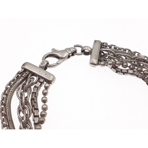 104 - A multi strand 925 Silver bracelet in good order with working clasp. Weight 25.7g approx#126