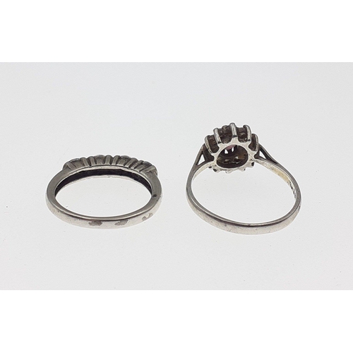 107 - Two rings. One size P stamped 9ct SIl 2.2g , The other size N marked PK CZ 2.8g#129