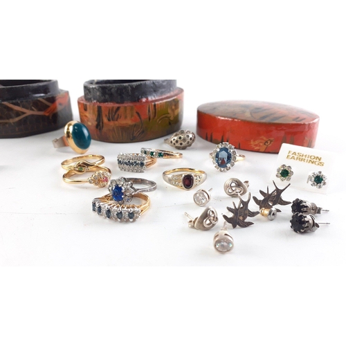 135 - Two papier mache small boxes filled with earrings, rings, pretty brooches, two vintage watches and o... 