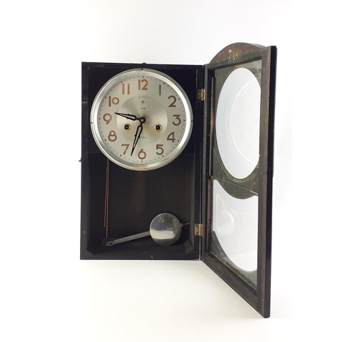 188 - POLARIS 15 Day vintage wall clock. With pendulum. No key. 45cm tall.  Some wear to finish but a styl... 