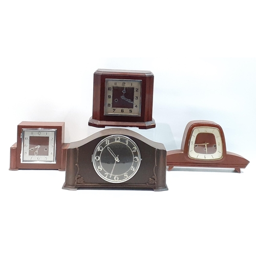 193 - A lot of four vintage wooden mantle clocks.  Assorted sizes and untested.#219