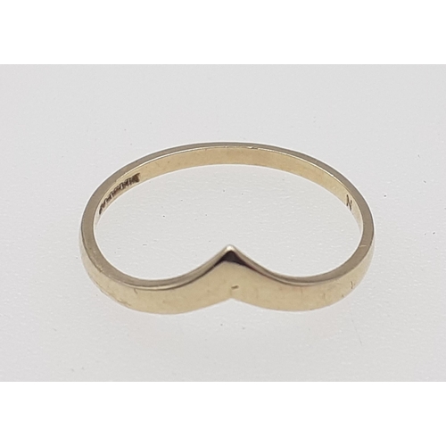 21 - A hallmarked 9ct wish bone ring Size M weigh 0.95g approx#21
