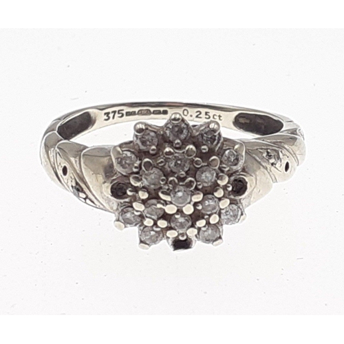 3 - A 375 fully marked white gold ring set with a diamond cluster of small stones (some missing).  Size ... 