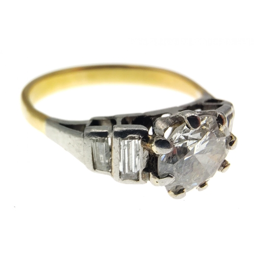 30 - A stunning Diamond ring with a 5.3mm centre stone and four baguette shoulder diamonds.  The shaft ap... 