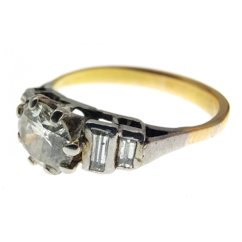 30 - A stunning Diamond ring with a 5.3mm centre stone and four baguette shoulder diamonds.  The shaft ap... 