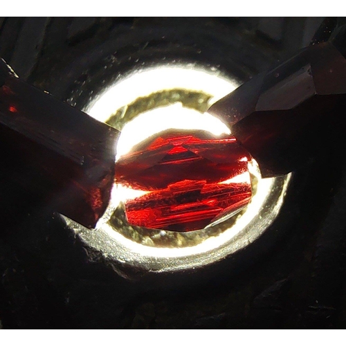 30E - An EXQUISITE VICTORIAN deep red garnet multi-strand bracelet on an unmarked white metal decorative f... 