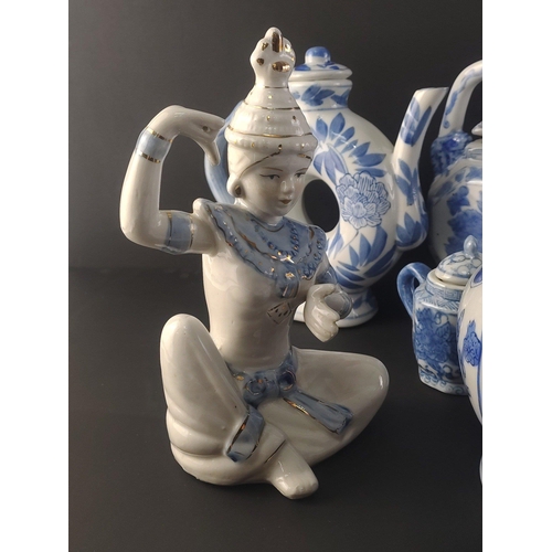 326 - A good collection of Oriental Ceramic pieces to include interesting teapot model of child with dog (... 