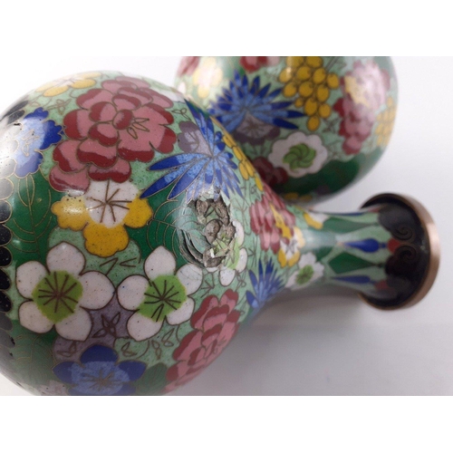 330 - A pair of cloissone on metal matching vases.  Each 17cm .  One has a small dent noted to the finish ... 