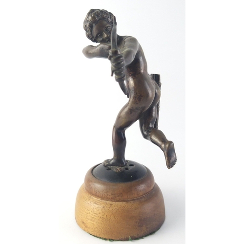 365 - An exceptionally well sculpted small bronze model of Cupid on wooden plinth. Stands 15cm tall. Unsig... 