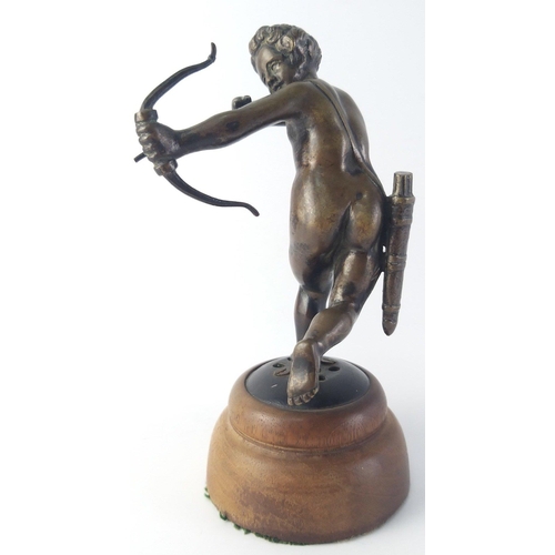 365 - An exceptionally well sculpted small bronze model of Cupid on wooden plinth. Stands 15cm tall. Unsig... 