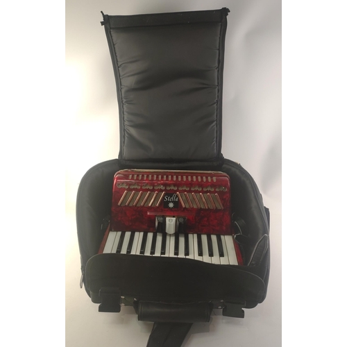 421 - A STELLA basic Accordion in case. 16 keys and 48 buttons. In nice condition#449
