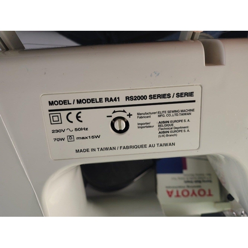 449 - TOYOTA RS2000 series Sewing Machine. Working, with mains cable, instructions and pedal. Good quality... 