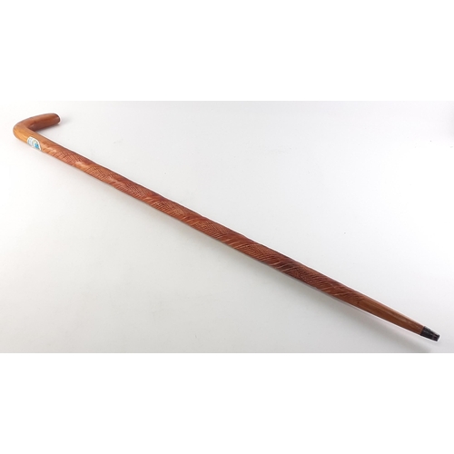 474 - An attractive carved wood walking stick with windermere badge, 92cm approx.#502