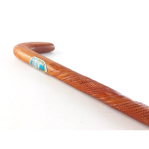 474 - An attractive carved wood walking stick with windermere badge, 92cm approx.#502