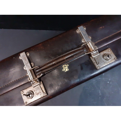 476 - An antique suitcase. Large and decorative and in good condition, displays well. Measures 66cm x 40cm... 