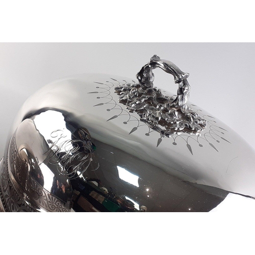 80 - Two very large plated meat covers with ornate acorn leaf handles and monograms.The largest 45cm acro... 