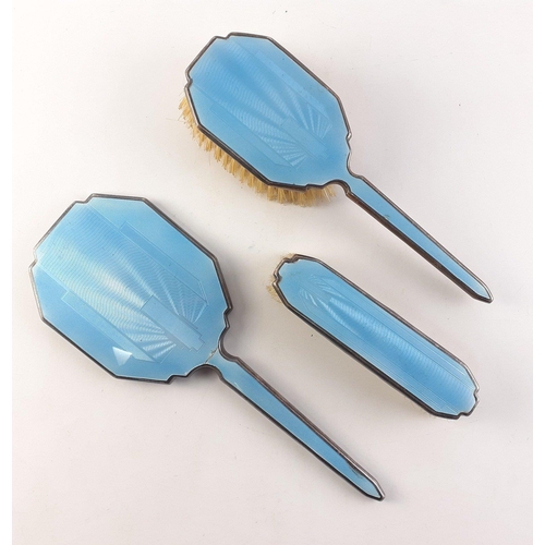 83 - Dressing table set of three.  Two brushes and a mirror.  Plated mounts with enamel style light blue ... 