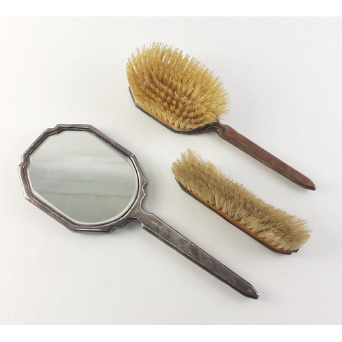 83 - Dressing table set of three.  Two brushes and a mirror.  Plated mounts with enamel style light blue ... 