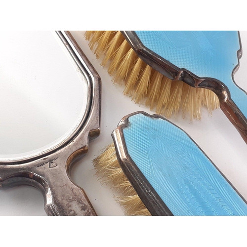 83 - Dressing table set of three.  Two brushes and a mirror.  Plated mounts with enamel style light blue ... 