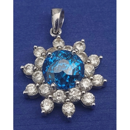 20 - A rare BLUE DIAMOND pendant set in a floral bed of twenty white diamonds set on a 14K white gold mou... 