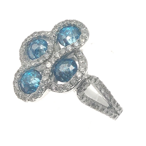 25 - A four stone BLUE DIAMOND ring set in 14K mount with multiple small diamonds. Each blue Diamond appr... 