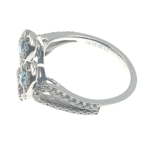 25 - A four stone BLUE DIAMOND ring set in 14K mount with multiple small diamonds. Each blue Diamond appr... 