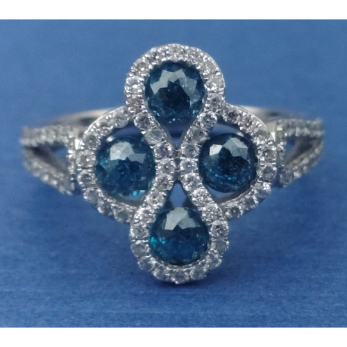 25 - A four stone BLUE DIAMOND ring set in 14K mount with multiple small diamonds. Each blue Diamond appr... 