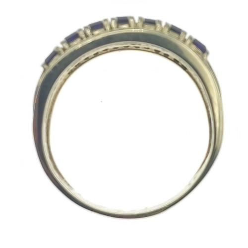 30 - Lovely unmarked yellow metal ring (purchased in America and tests as 14ct) with seven Amethyst stone... 