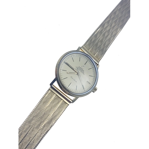 65 - OMEGA GENEVE 18ct Gold gents watch with 18ct gold flat stamped ribbon bracelet. Total gross weight 6... 